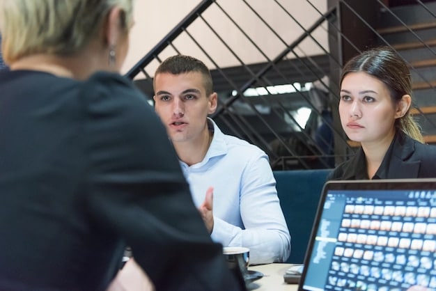 A cybersecurity professional conducting a training session for a group of employees in a conference room. The presentation on the screen highlights key steps for identifying and preventing BEC scams, such as verifying email senders and avoiding suspicious links.