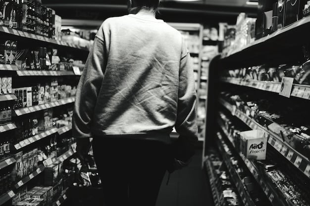 A black and white photo depicting a person discreetly placing an item into their bag in a grocery store. Surveillance cameras are visible but out of focus in the background, adding a sense of tension.