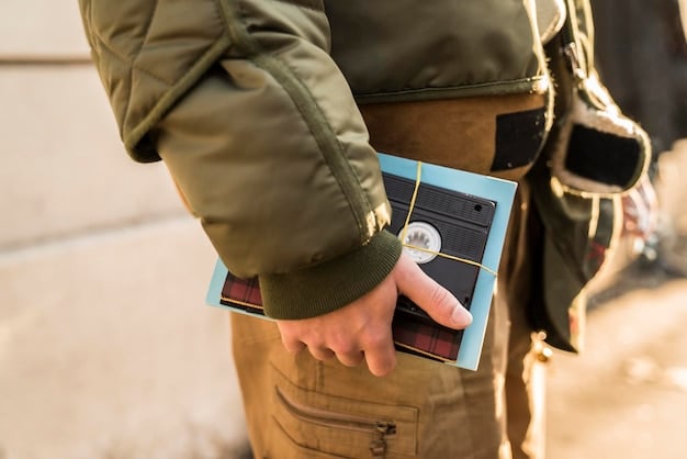 A border patrol officer using a handheld device to scan documents and verify information in a remote border location, emphasizing the mobility and connectivity enabled by modern technology. The officer is wearing standard uniform and equipment.
