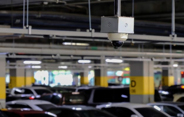 A well-lit, open-plan parking garage with clear signage, visible security cameras, and minimal hiding spots. Pedestrians are seen walking confidently towards their vehicles, highlighting the security and safety engendered by CPTED principles applied to parking facilities.