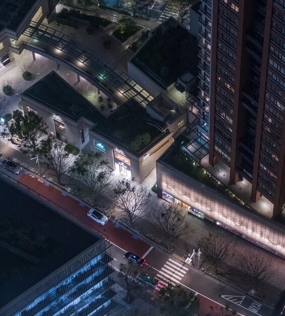A night scene of a city street with multiple CCTV cameras visible, highlighting the ubiquitous presence of surveillance technology in urban environments.
