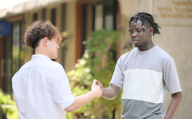 A local police officer shaking hands with a neighborhood resident during a community safety event, showcasing collaboration and trust between law enforcement and the community.